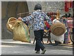20071022 1052-28 DD 5073 Yangshuo Woman with baskets.JPG