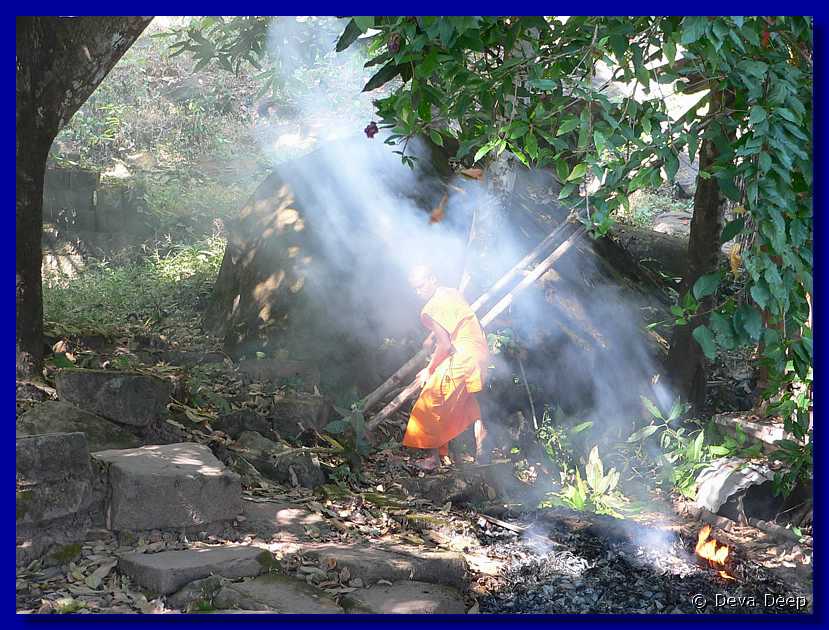 584  Champasak Wat Phu Champasak Monks-fire-smoke