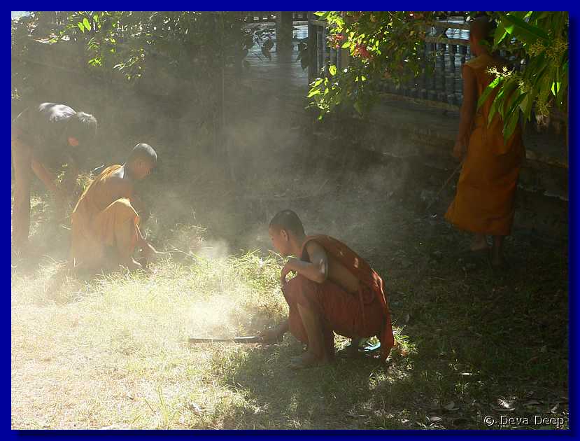 606  Champasak Wat Phu Champasak Monks-fire-smoke