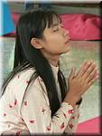 2908 Mandalay Kuthodaw Paya Girl praying.jpg