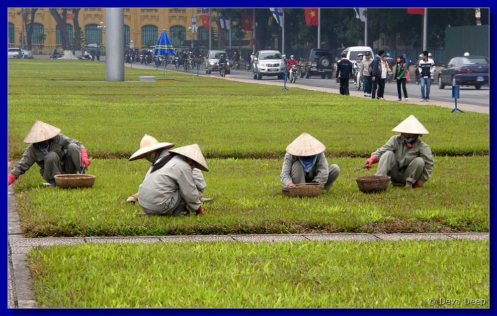 Hanoi Ho Chi Minh Mausoleum Women in grass-ifa-cr-028